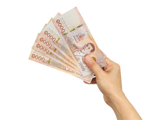 Thai baht banknotes cash money in woman hand isolated on white background with clipping path.