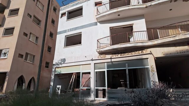 Abandoned buildings in Varosha, a deserted city district, captured under bright sunlight
