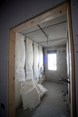 construction site, sponge used inside a plasterboard structure seen from outside