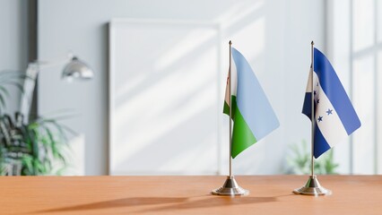 FLAGS OF DJIBOUTI AND HONDURAS ON TABLE