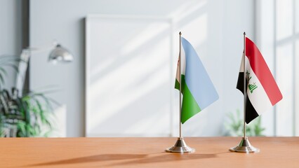 FLAGS OF DJIBOUTI AND IRAQ ON TABLE