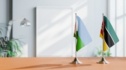 FLAGS OF DJIBOUTI AND MOZAMBIQUE ON TABLE