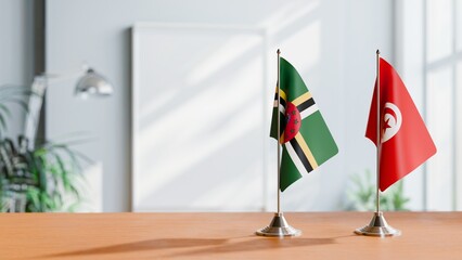 FLAGS OF DOMINICA AND TUNISIA ON TABLE