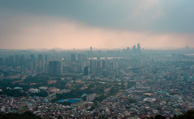 Naklejka premium Aerial panorama sunset view of Seoul, Korea from Namsam Mountain on a moody day