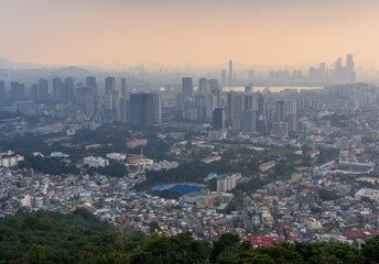 Fototapeta premium Aerial panorama sunset view of Seoul, Korea from Namsam Mountain on a moody day