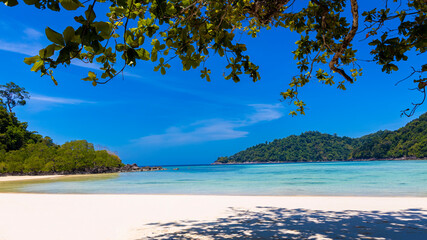 white sand beach tropical with seashore as the island in a coral reef ,blue and turquoise sea Amazing nature landscape with blue lagoon