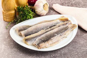 Marinated salted herring fillet apetizer