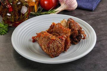 Baked beef ribs with vegetables