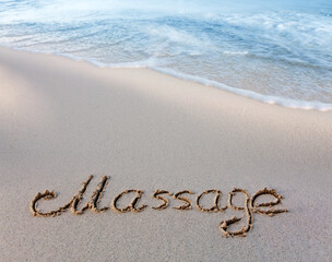 Word massage handwritten on the caribbean sand.