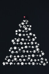 Christmas background. Spruce from a garland with stars.