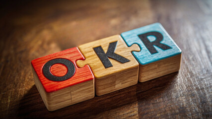 OKR Wooden Puzzle Blocks Concept for Goal Setting and Business Strategy