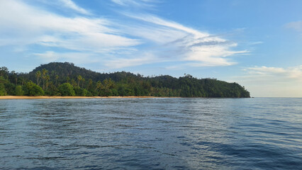 Beautiful views of hills or island. the blue sky is slightly cloudy. Mandeh, West Sumatra, Indonesia