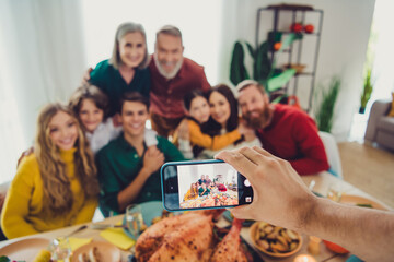 Photo of positive happy people celebrating thanksgiving day weekend photographing friendly family...