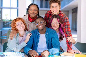 Group of happy and smiling multiethnic friends looking at camera.