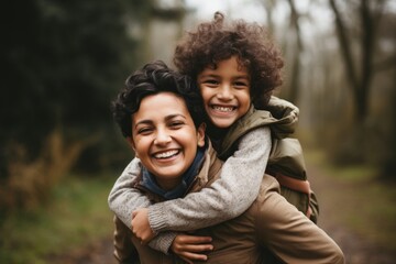 Naklejka premium South asian mother and son smile laughing hugging.
