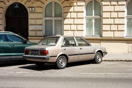 Old Nissan Sunny B11 5th generation car parked on street