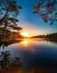 Obraz premium Sunset Serenity: Tranquil Lake Landscape with Trees