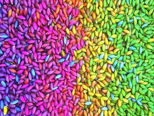 Colorful array of vibrantly dyed seeds arranged in a rainbow gradient on a flat surface. Perfect as wallpaper or backdrop.