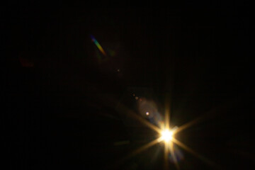 Sun flare on the black background