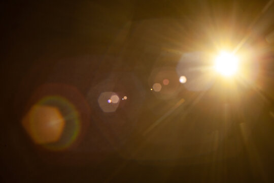 Sun flare on the black background