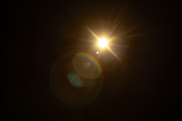 Sun flare on the black background