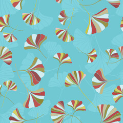 A seamless pattern of ginkgo leaves in  various colors on a blue background, a variation of hand-drawn ginkgo leaves