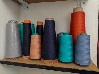collection of sewing thread rolls in various colors 