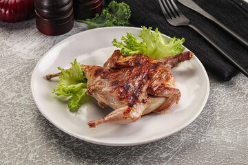 Grilled quail in the plate
