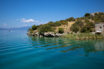 Fototapeta premium Museum on water in the Bay of Bones on the Ohrid Lake in North Macedonia. Popular tourist destination - Amazing landscape.