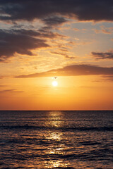 Beautiful cloudscape over the sea, sunrise vertical shot