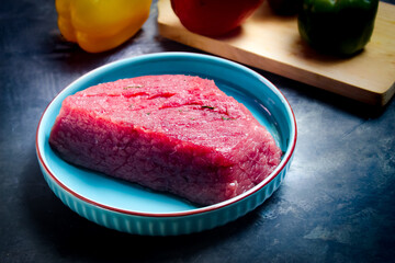 raw red beef with ingredients