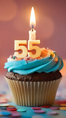 Birthday cupcake with burning lit candle with number 55. Number fiftyfive for fifty years or fifty-fifth anniversary.