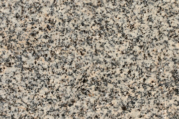 Texture of marble with red, black and white particles of a column head in Perge ancient city