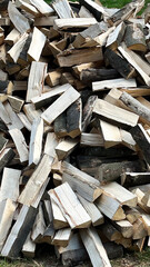 Chopped firewood, huge pile of firewood from wood. Wood background