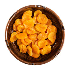 Dried apricots in metal bowl isolated on white. Top view.
