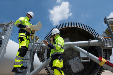 Wind Turbine Maintenance and Repair Technician, Engineer Checking Turbines working maintenance clean power generator system