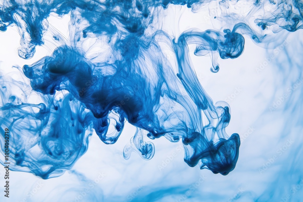 Wall mural dynamic blue ink swirling in water, creating beautiful abstract patterns and textures for artistic b
