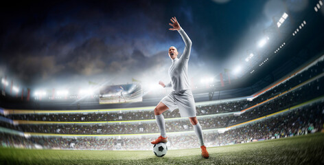 Soccer players in action. Champion. Sport emotion. Happy soccer player celebrate a victory on a professional night football stadium. Sport © Ruslan Shevchenko