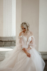 Fototapeta premium fashion photo of gorgeous woman with blond hair in luxurious wedding dress