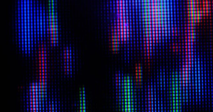 Extreme macro view of 4K LED matrix red, blue, and green sub-pixels, monitor, or TV screen