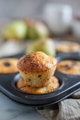 Muffins with chocolate and pears 