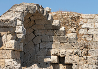 Stone arched shops along the eastern edge of the stadium in the ancient city of Perge in Antalya