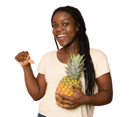 Photo of charming happy afro american woman hold pineapple summer fruit isolated over transparent ackground