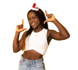 Young african american girl wearing christmas hat over transparent background smiling making frame with hands and fingers with happy face. Creativity and photography concept.