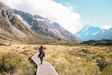 Woman Walking Through a Mountainous Landscape
