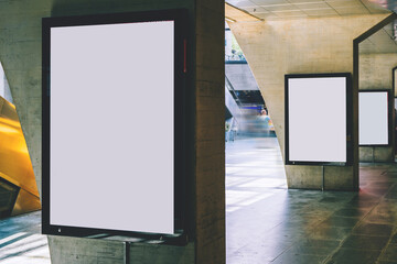 Clear Billboard in public place with blank copy space screen for advertising or promotional poster content, empty mock up Lightbox for information, blank display in station area with daylight
