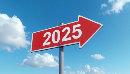 Fototapeta premium A red road sign pointing to 2025 against a blue sky with clouds