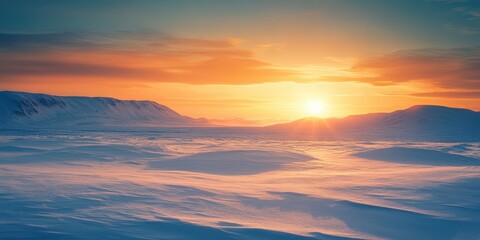 Obraz premium A stunning winter sunrise illuminating a peaceful snow-covered landscape, showcasing vibrant colors and serene beauty.