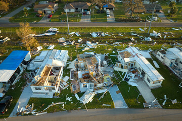 Badly damaged mobile homes after hurricane Ian in Florida residential area. Consequences of natural...
