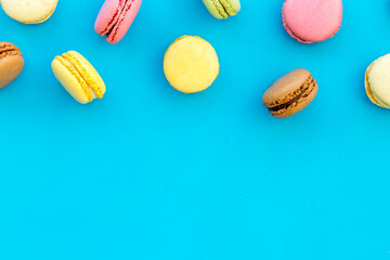 sweet dessert pattern with macarons on blue background flat lay mockup